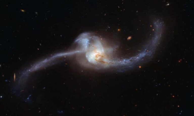 The two galaxies orbited together in a cosmic collision captured by ...